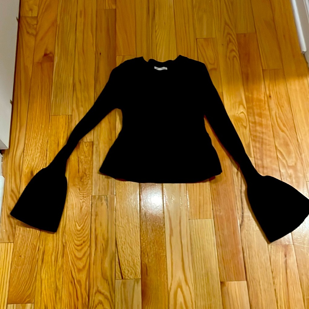 Never been worn XS black peplum sweater with bell sleeves